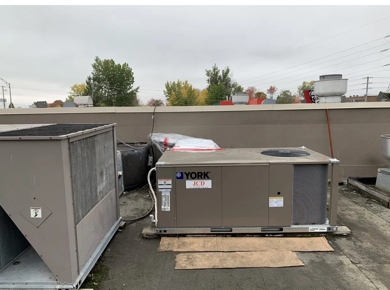 York rooftop unit with a JCD label on a commercial roof